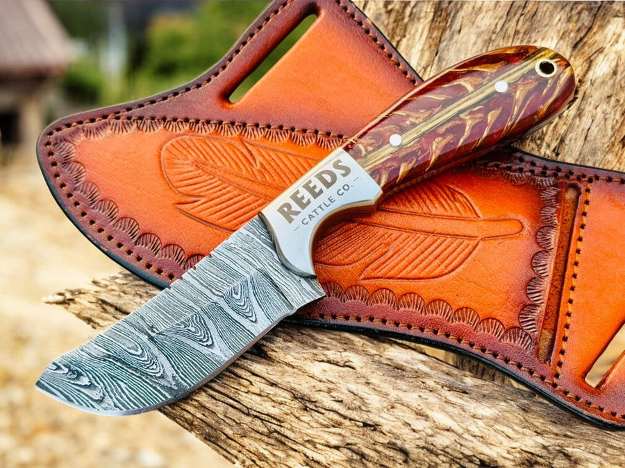 Damascus Cowboy Knife – 3.25" Blade, Red Epoxy Pine Cone Resin + Steel Bolster product photo