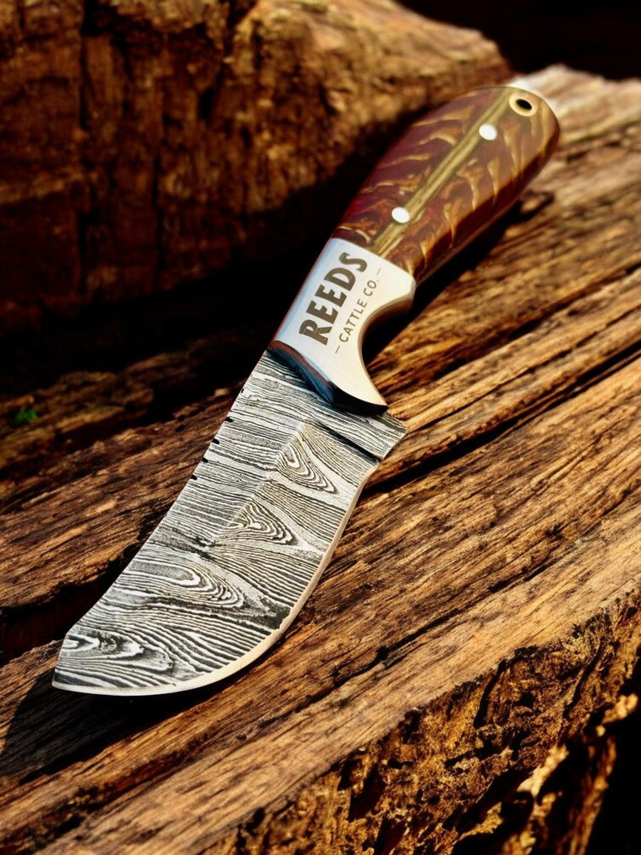 Damascus Cowboy Knife – 3.25" Blade, Red Epoxy Pine Cone Resin + Steel Bolster product photo