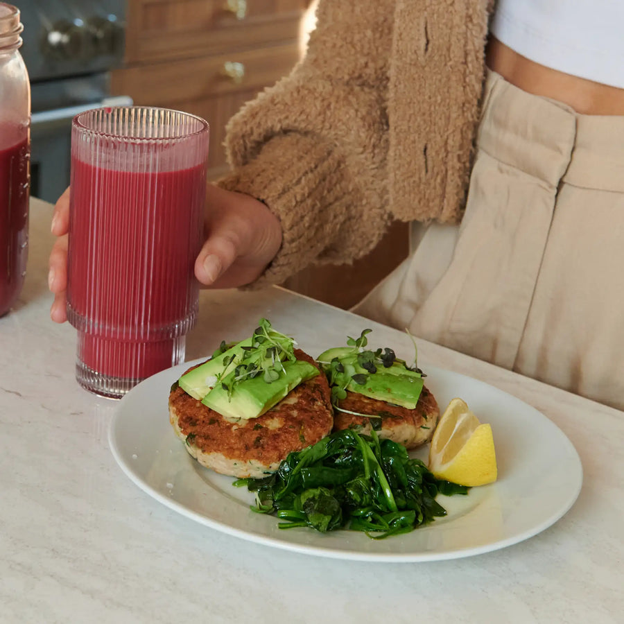 Pink shake beside a plated meal illustrating the kit
