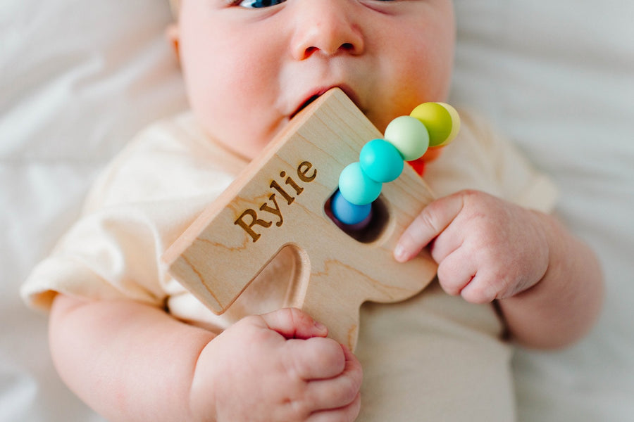 Wooden Letter Grasping Toy with Silicone Beads: letter examples