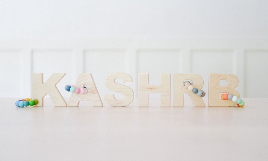 Wooden Letter Grasping Toy with Silicone Beads: letter examples
