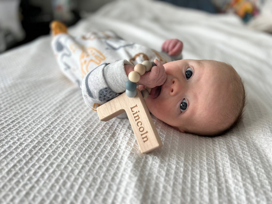 Wooden Letter Grasping Toy with Silicone Beads: letter examples
