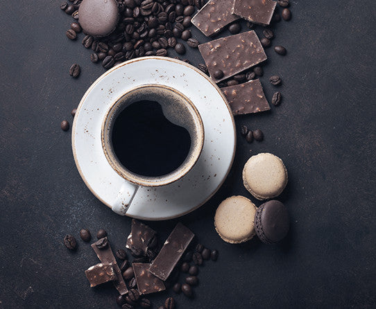 Coffee, chocolate and almond cookies pictured as flavor inspiration for Amaretto coffee