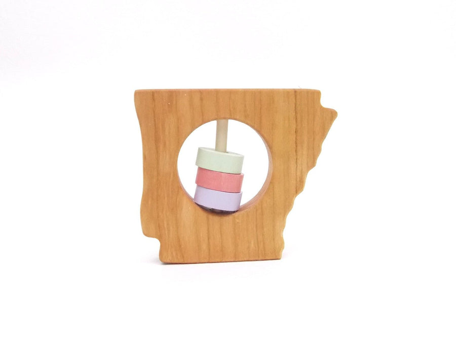 Arkansas state-shaped cherry wood baby rattle with colored center disks