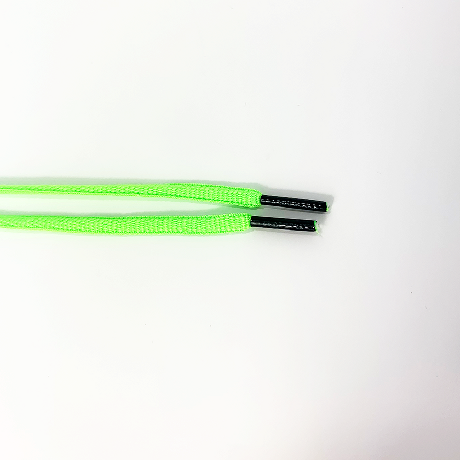 Neon Green oval athletic shoelaces close-up of oval lace ends and wrapped aglets