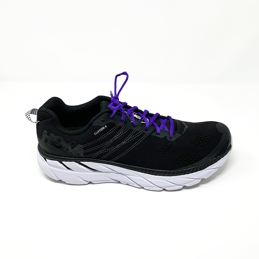 Purple oval athletic shoelaces laced into a black running shoe