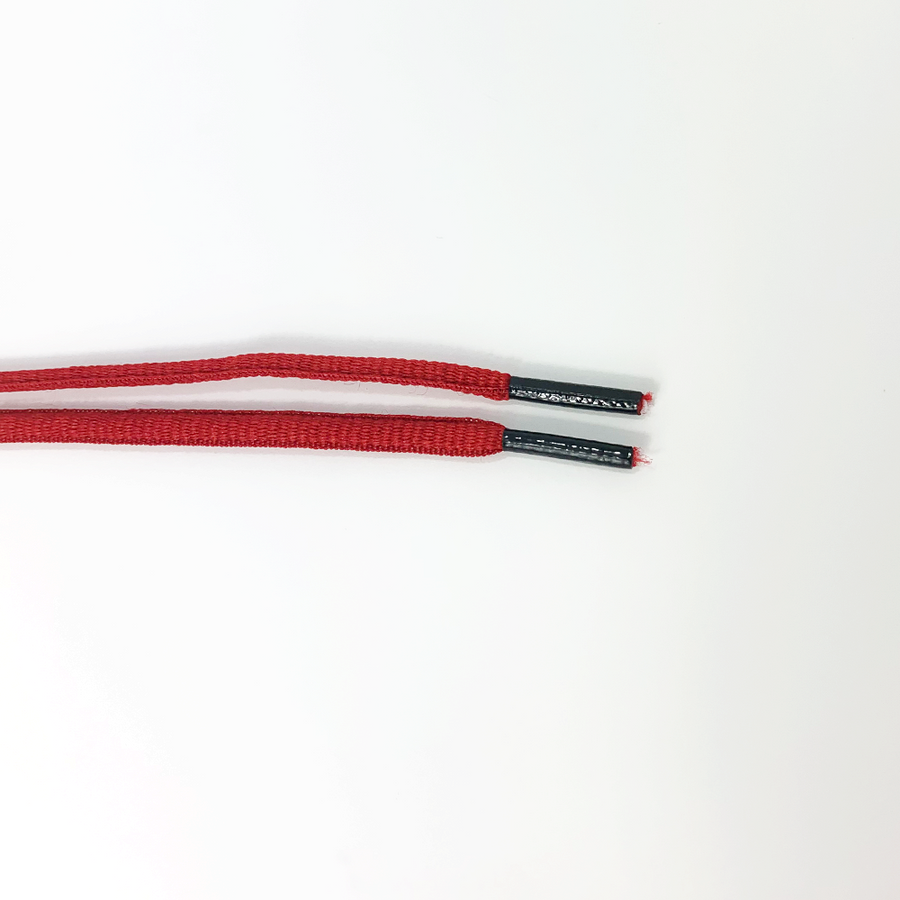 Red oval athletic shoelaces close-up of oval lace ends and wrapped aglets