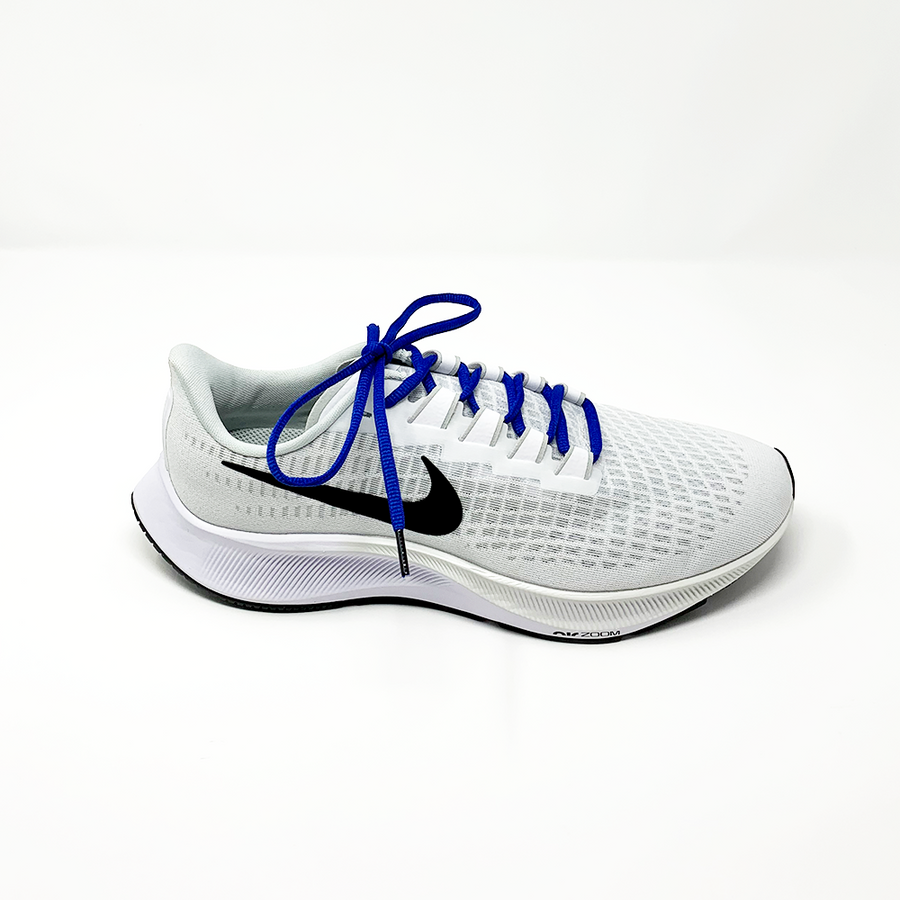 Blue oval athletic shoelaces laced into a light gray running shoe