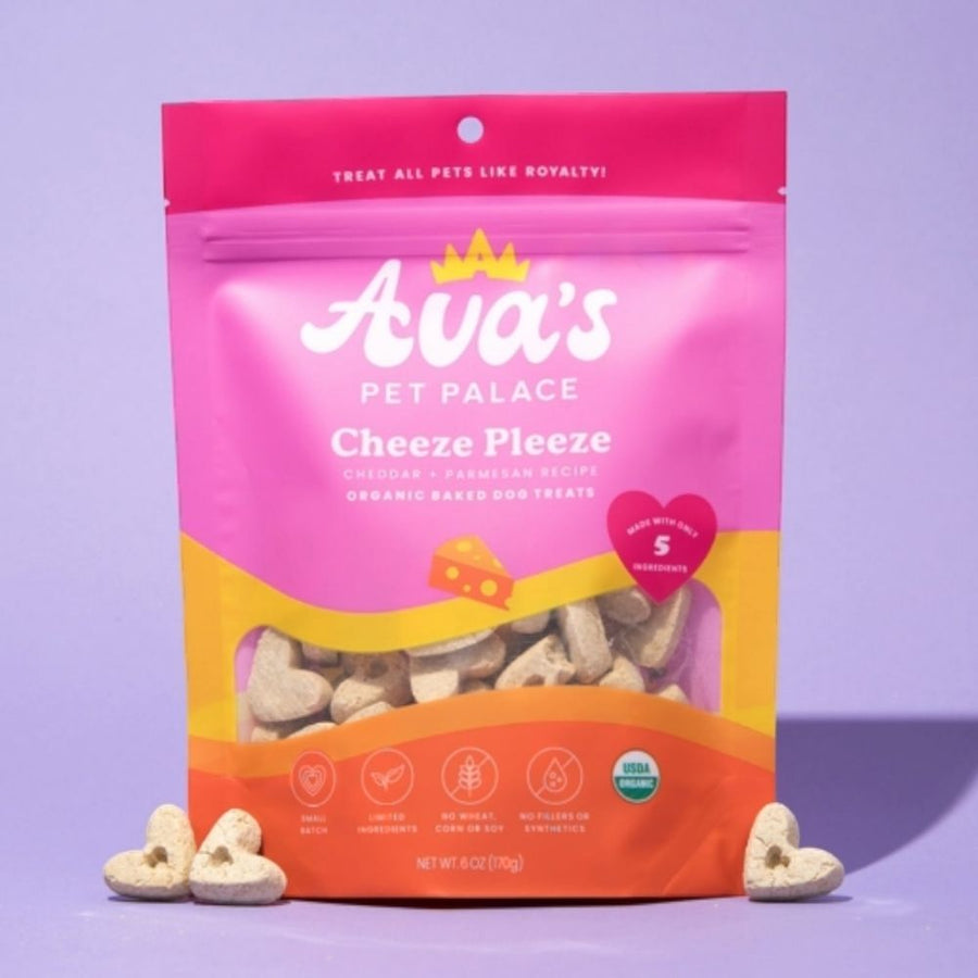 Cheeze Pleeze bag beside heart-shaped biscuits on a purple background