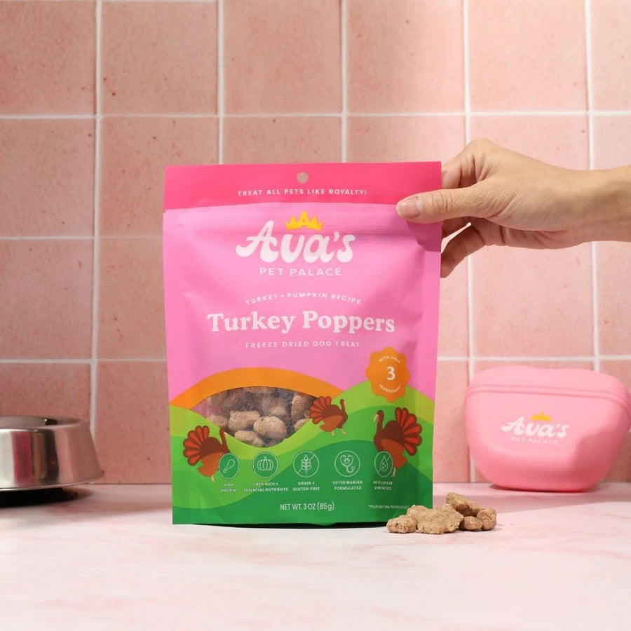Turkey Poppers bag and loose treats beside a bowl