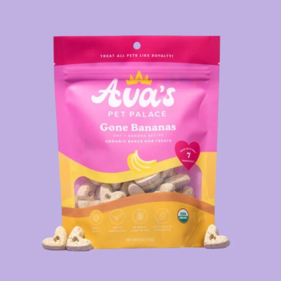Gone Bananas bag beside heart-shaped biscuits on a purple background