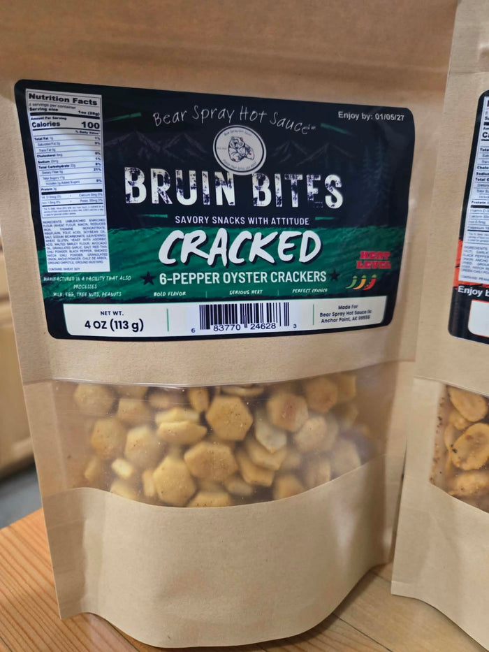 Cracked 6-pepper oyster crackers in a kraft pouch with a green Bruin Bites label marked 4 oz