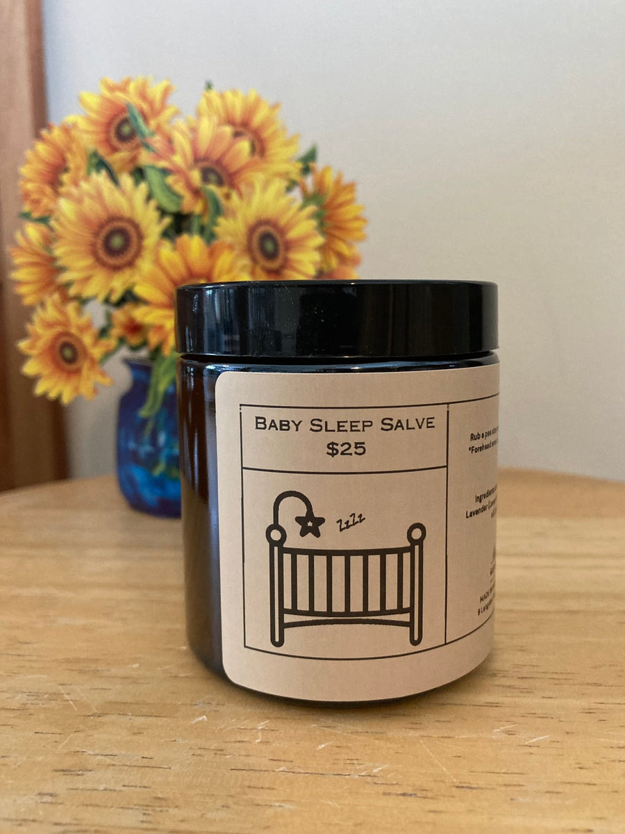 Chamomile & Lavender Salve in its amber glass jar with supplier branding