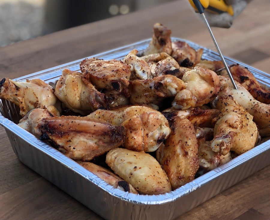 Jallelujah Jalapeño Bacon BBQ Seasoning: Cooked chicken drumsticks in a foil pan