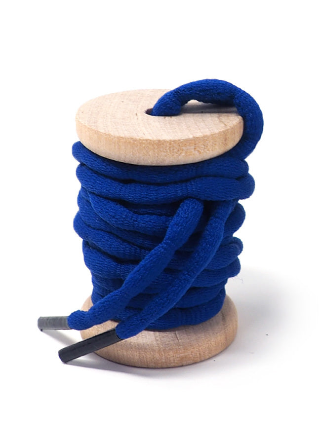 Blue bubble-braid shoelaces wound around a wooden spool