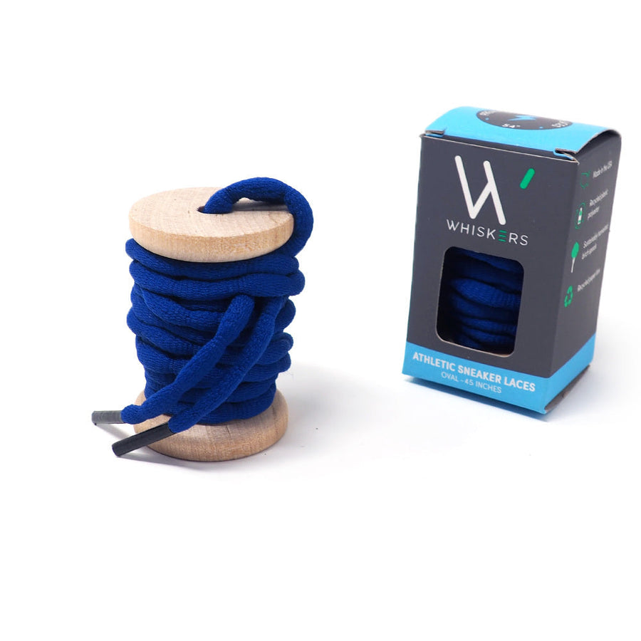 Blue bubble-braid shoelaces on a wooden spool beside the retail box
