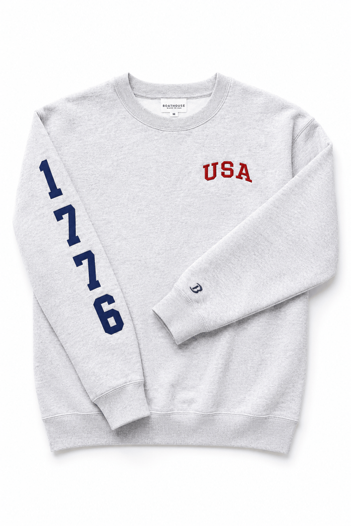 USA 1776 Crewneck Sweatshirt: grey 1776 crewneck, folded sleeve view.