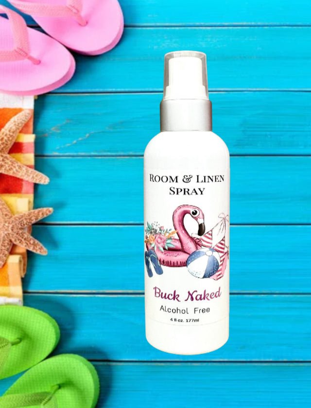 Buck Naked room and linen spray bottle with a flamingo label against a turquoise background