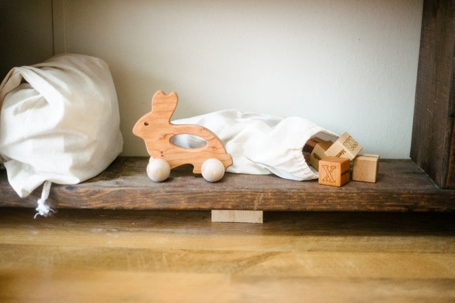 Wooden Bunny Push Toy: Cherry Wood with Rolling Wheels