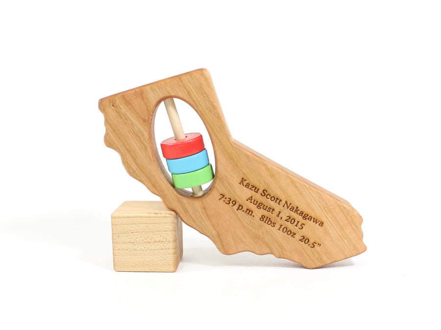California cherry wood rattle with an example of engraved personalization
