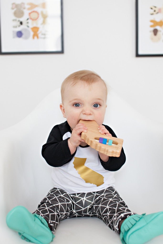 California cherry wood rattle in a lifestyle setting