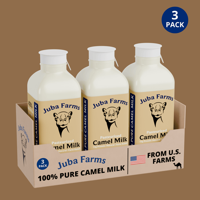 Three 16 fl oz bottles of pasteurized camel milk in a branded carton