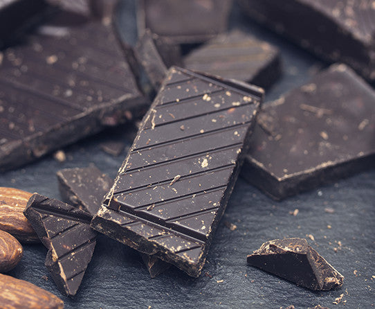 Chocolate pieces pictured as flavor inspiration for Chocolate Almond coffee