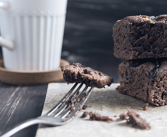 Chocolate brownies pictured as flavor inspiration for Chocolate Indulgence Decaf coffee