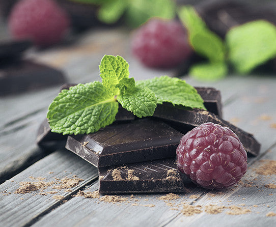 Chocolate and raspberries pictured as flavor inspiration for Chocolate Raspberry coffee