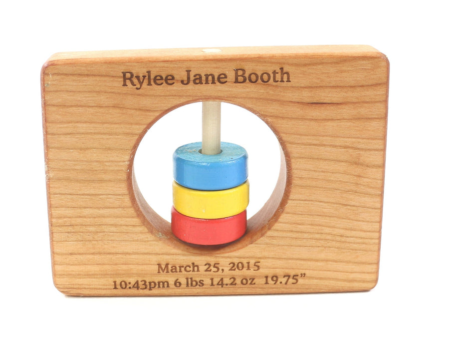 Colorado cherry wood rattle with an example of engraved personalization