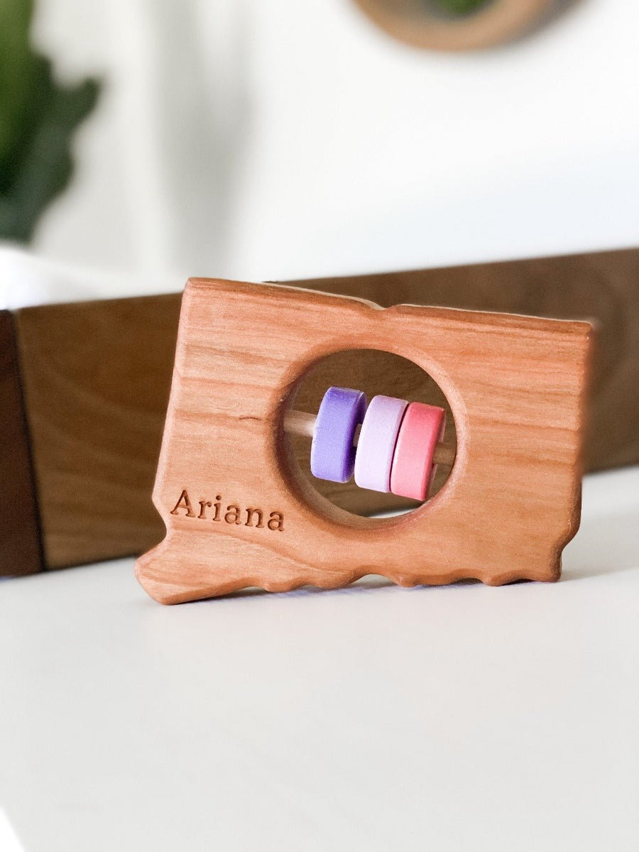 Connecticut cherry wood rattle with an example of engraved personalization