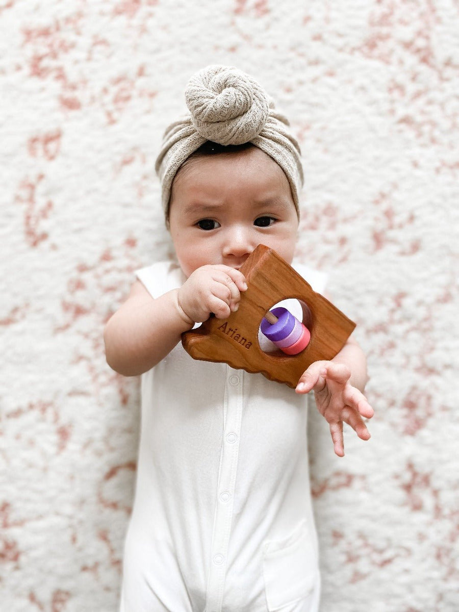 Connecticut cherry wood rattle in a lifestyle setting