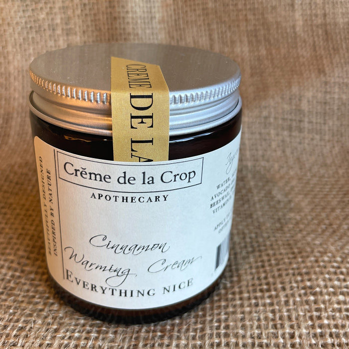 Everything Nice Cinnamon Oil Moisturizing Cream in its labeled container