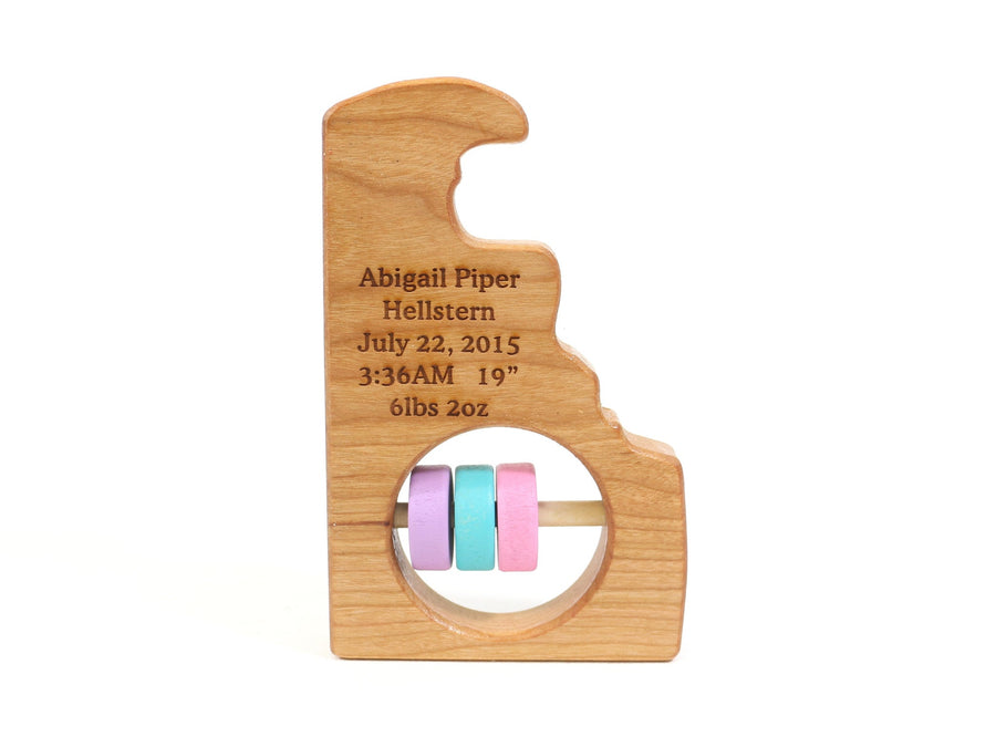 Delaware cherry wood rattle with an example of engraved personalization