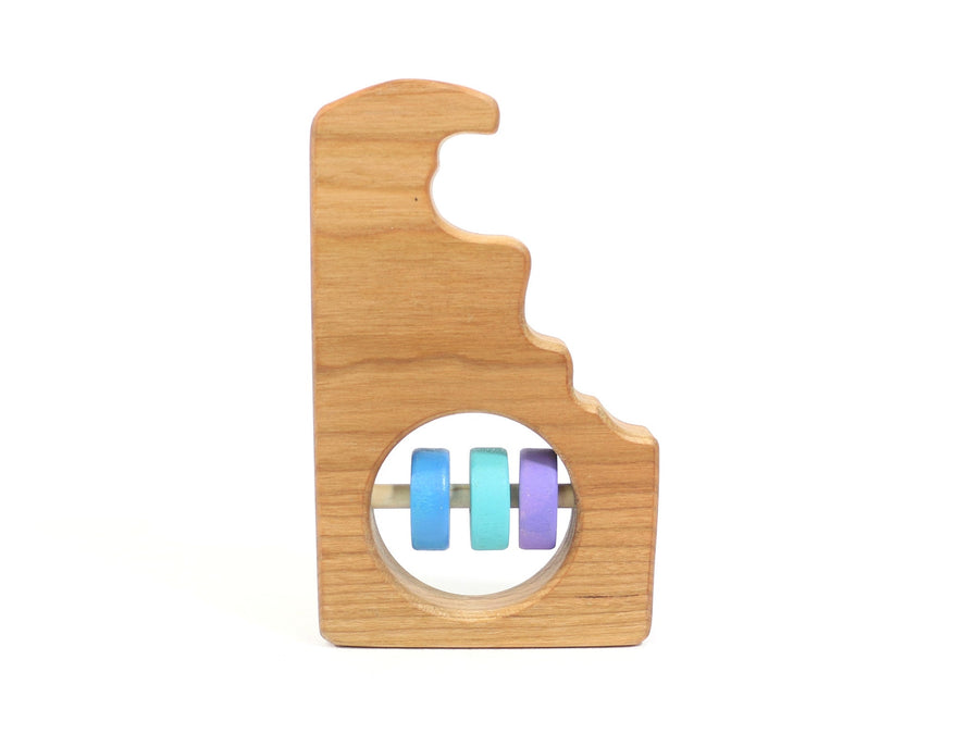 Delaware state-shaped cherry wood baby rattle with colored center disks