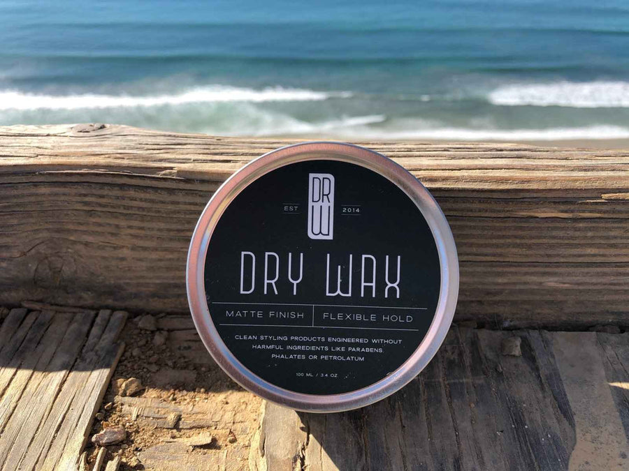 Dry Wax jar beside a beach boardwalk