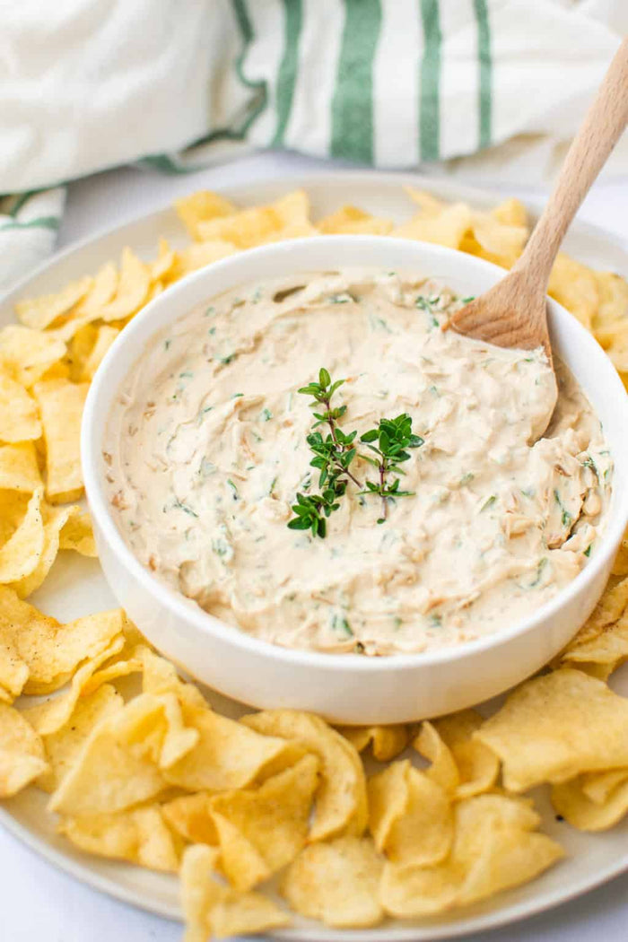 French onion dip in a bowl with potato chips