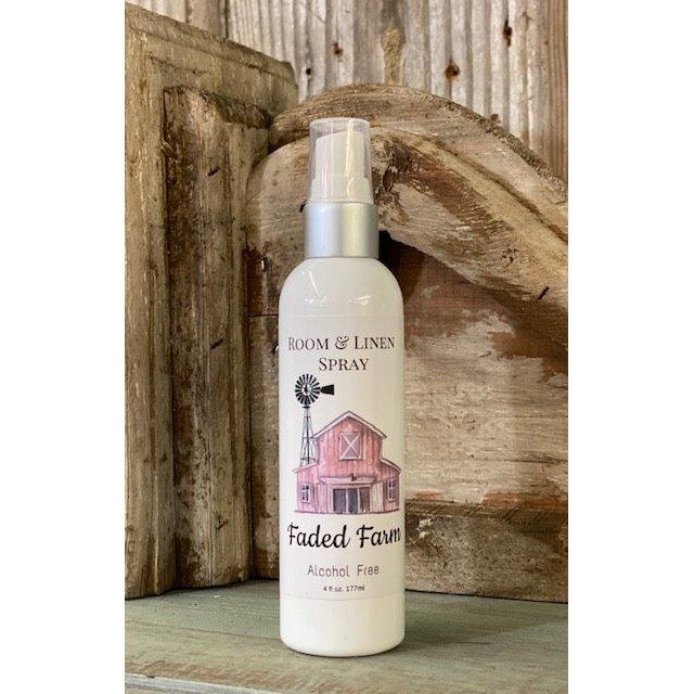 Faded Farm room and linen spray bottle with a barn and windmill label against rustic wood