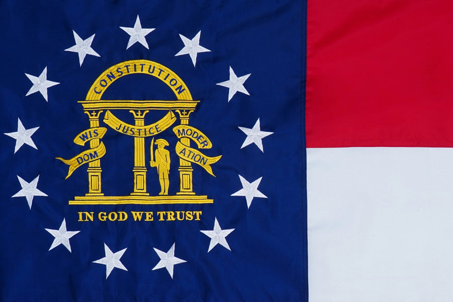 Georgia state flag close-up with coat of arms and 13 stars