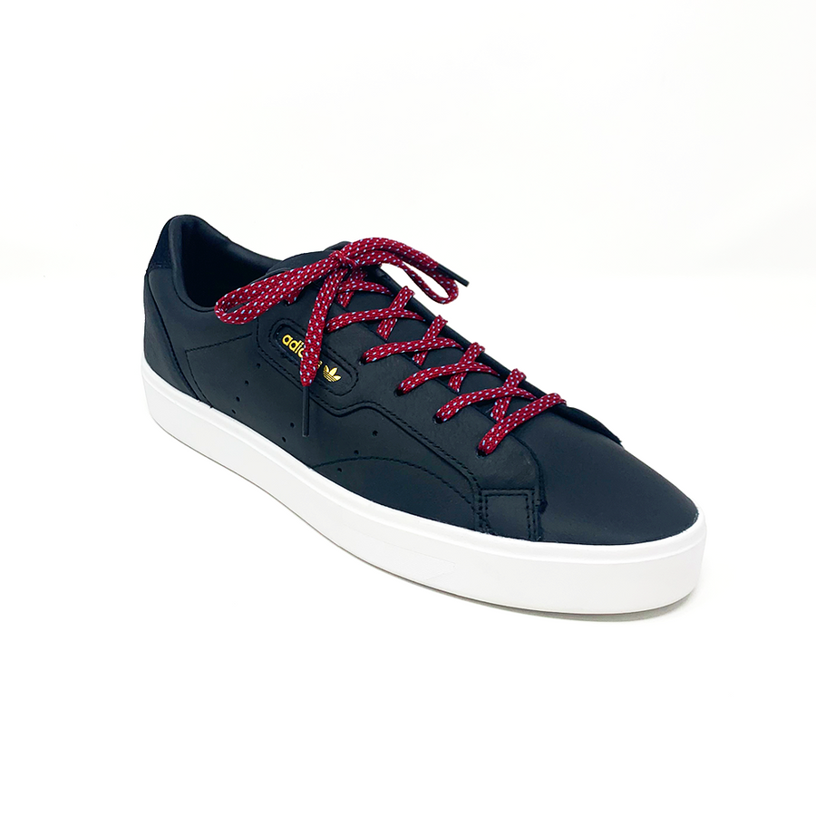 Garnet & Light Blue ticked flat shoelaces laced into a black low-top sneaker
