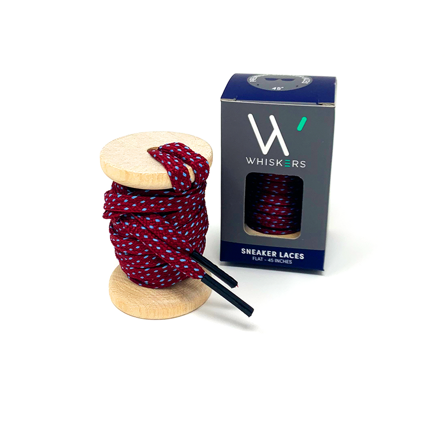 Garnet & Light Blue ticked flat shoelaces on a wooden spool beside the retail box