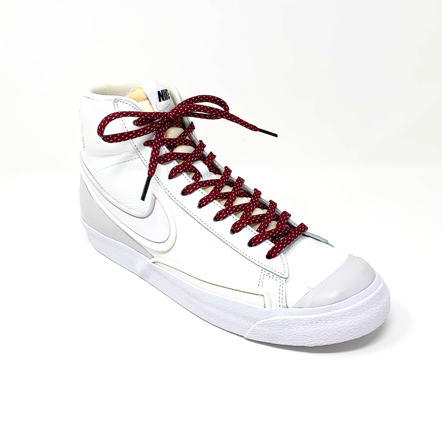 Garnet & Light Blue ticked flat shoelaces laced into a white high-top sneaker