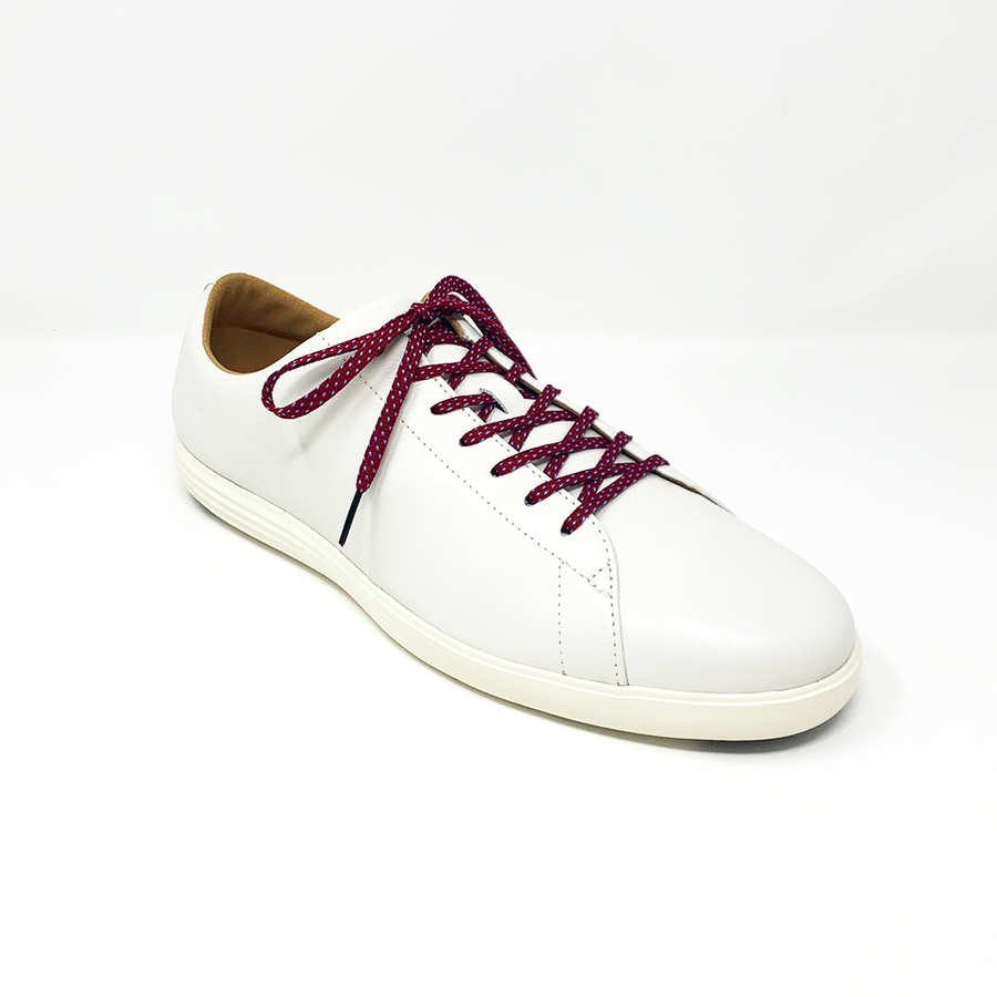 Garnet & Light Blue ticked flat shoelaces laced into a cream low-top sneaker