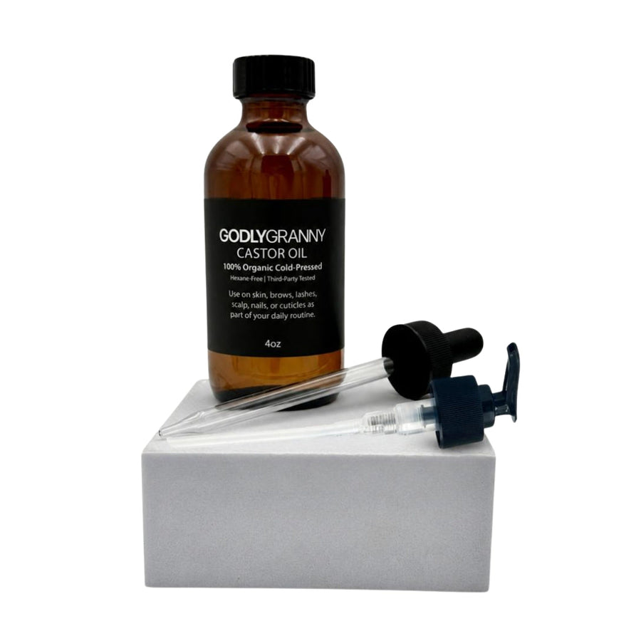 Amber castor oil bottle with pump and dropper attachments shown