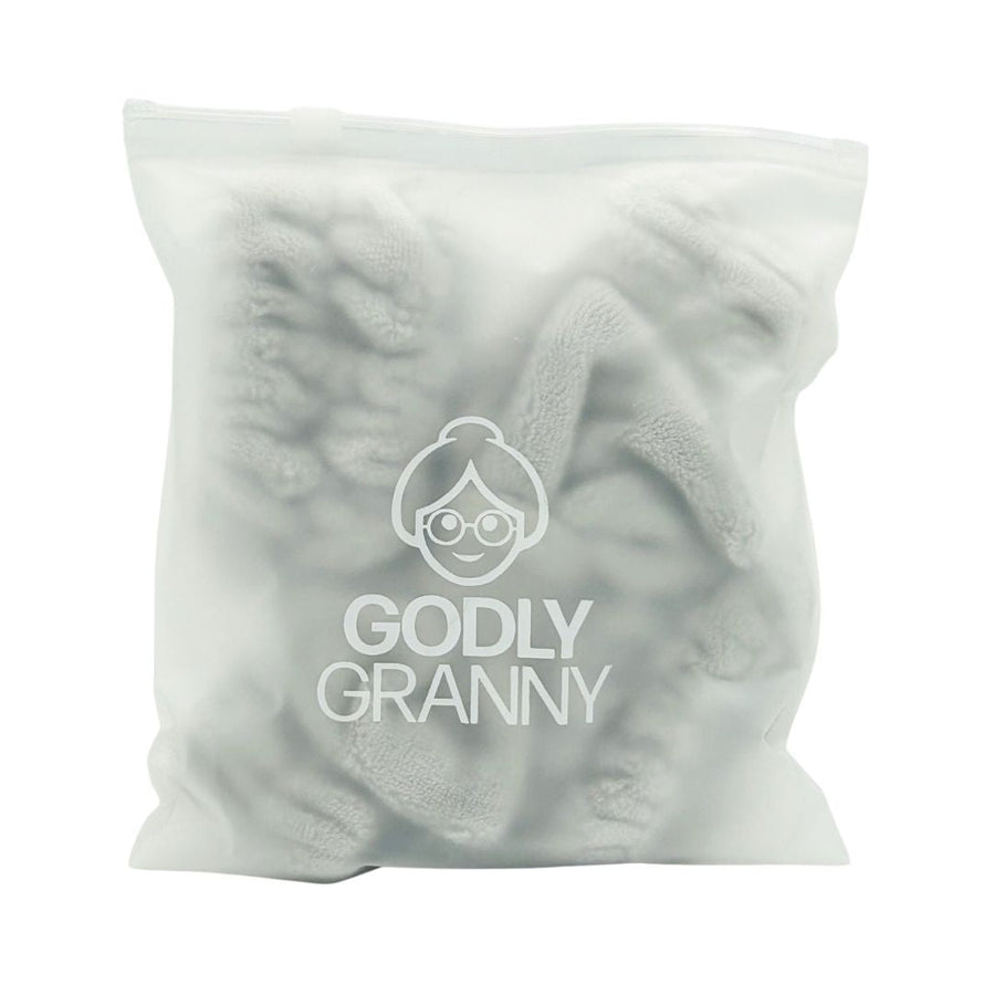 Gray headband and wristband set inside a logo storage bag