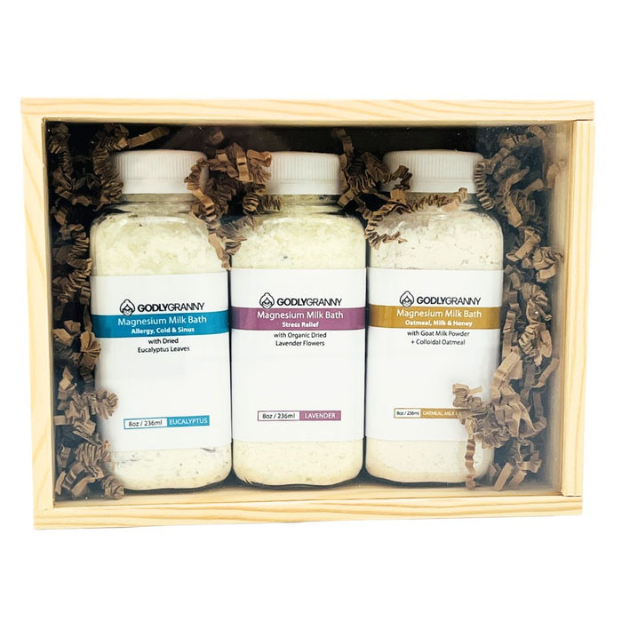 Three magnesium milk-bath bottles in a wooden keepsake gift box