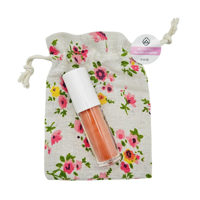 Tallow lip gloss roller bottle with a floral drawstring storage bag