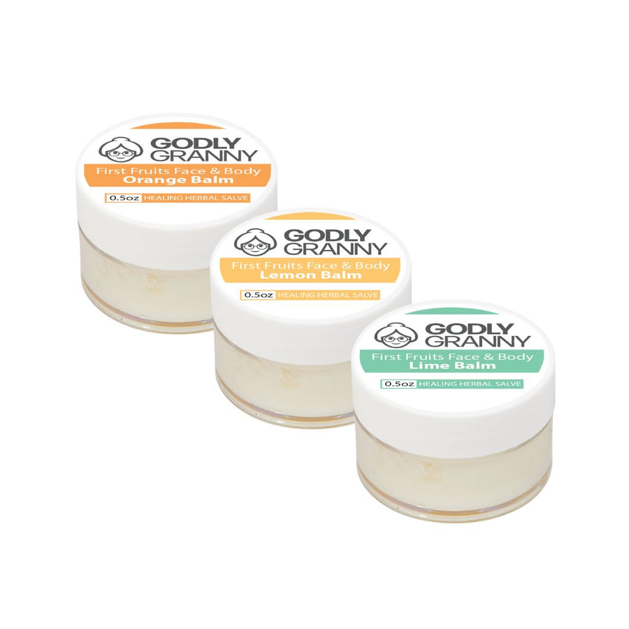 Assorted First Fruits Lemon Herbal Face & Body Salve packages shown together