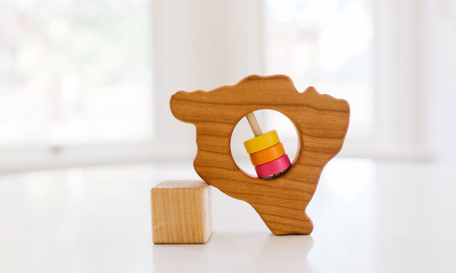 Hawaii Big Island state-shaped cherry wood baby rattle with colored center disks