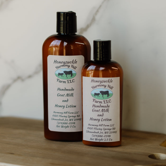 Goat milk and honey lotion bottles in 7 oz and 3.5 oz sizes with Honeysuckle labels